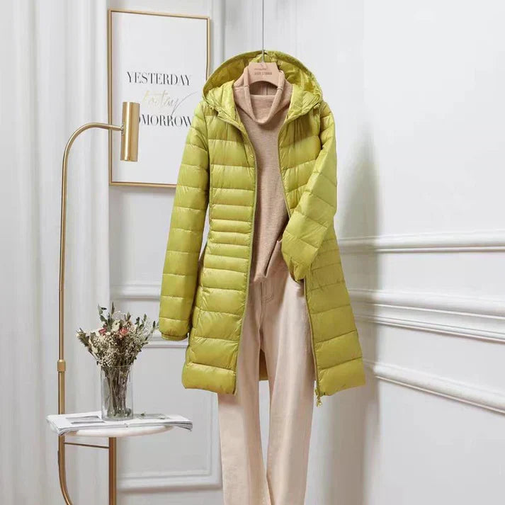 Women's lightweight hooded puffer jacket for winter. Insulated, warm, and stylish outerwear.
