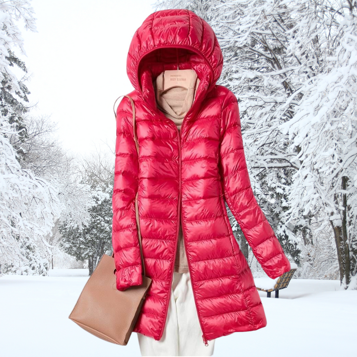 Warm women's insulated hooded puffer jacket. Lightweight design, perfect packable outerwear for cold trips.