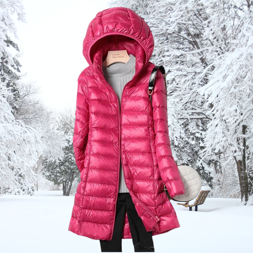 Stylish women's hooded puffer coat. Lightweight, insulated, and warm for fall and winter adventures.