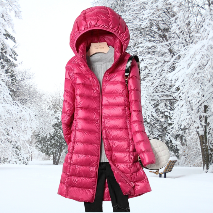 Stylish women's hooded puffer coat. Lightweight, insulated, and warm for fall and winter adventures.