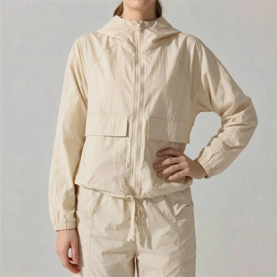 Versatile women's hooded activewear jacket. Lightweight & comfortable, perfect for running, training, or casual wear.
