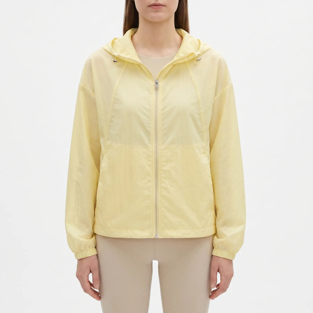 Stylish women's hooded windbreaker, an ideal lightweight outerwear choice for breezy spring & summer days.