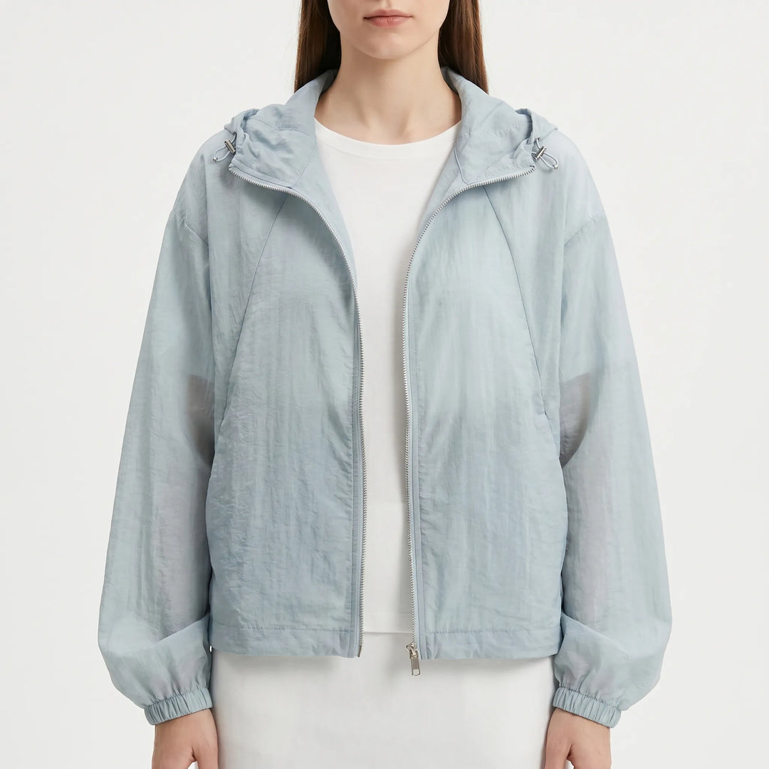 Versatile women's lightweight hooded windbreaker, a casual spring/summer jacket for everyday wear.