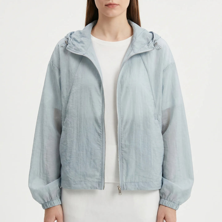 Versatile women's lightweight hooded windbreaker, a casual spring/summer jacket for everyday wear.