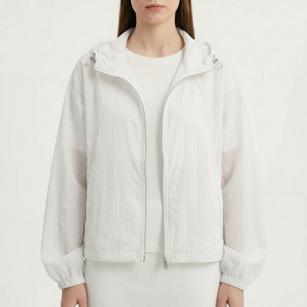 Packable women's lightweight hooded windbreaker, your go-to spring & summer travel jacket.
