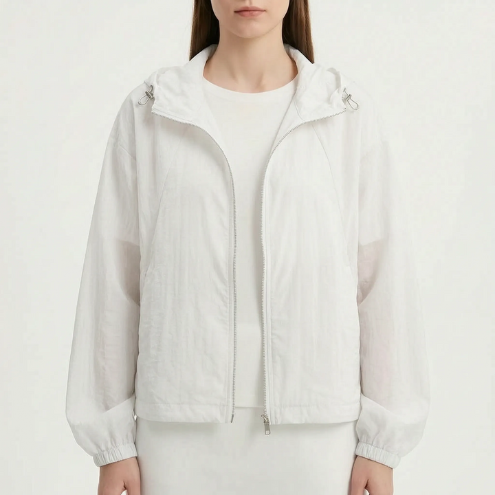 Packable women's lightweight hooded windbreaker, your go-to spring & summer travel jacket.