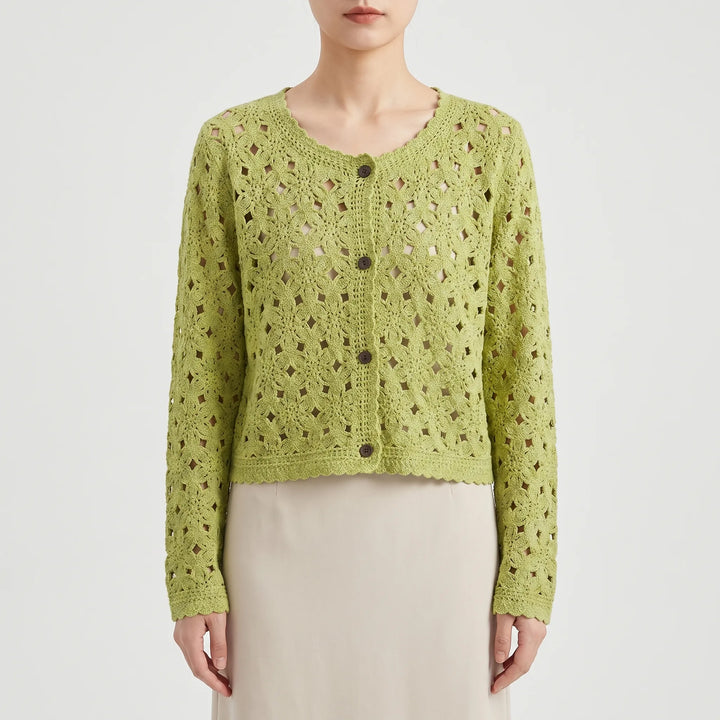 Close-up of delicate openwork crochet knit on a women's lightweight summer cardigan. Elegant texture.
