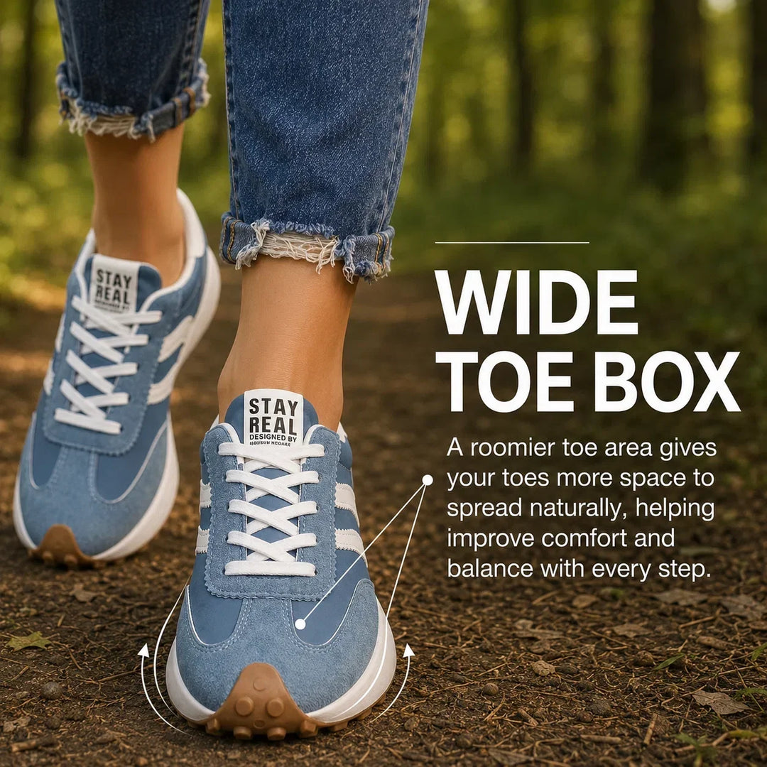 Grey women's orthopedic sneakers with excellent arch support, ideal for walking.