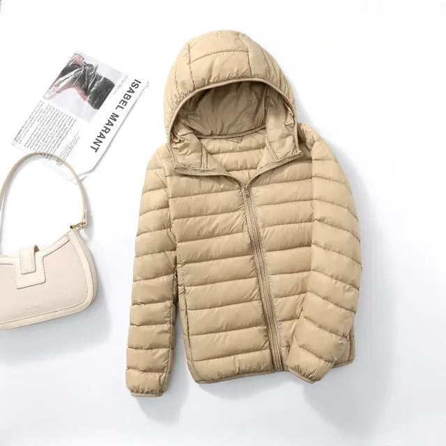 Women's all-season puffer jacket. Lightweight, warm, and packable for travel.