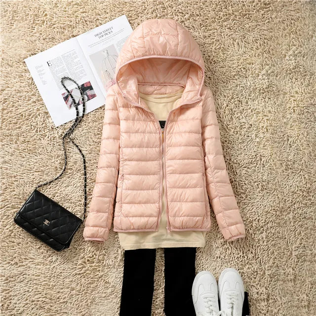 Warm hooded women's winter coat. Stylish & lightweight puffer for cold weather.