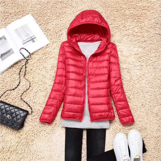 Warm women's hooded puffer coat. Essential outerwear for cold weather comfort.
