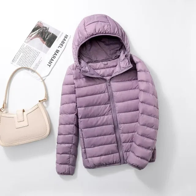 Everyday women's packable puffer jacket. Insulated & lightweight for year-round wear.