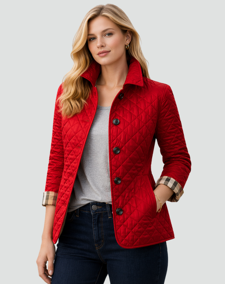 Full-length view of a women's comfortable quilted outerwear jacket, featuring a classic button-front closure.