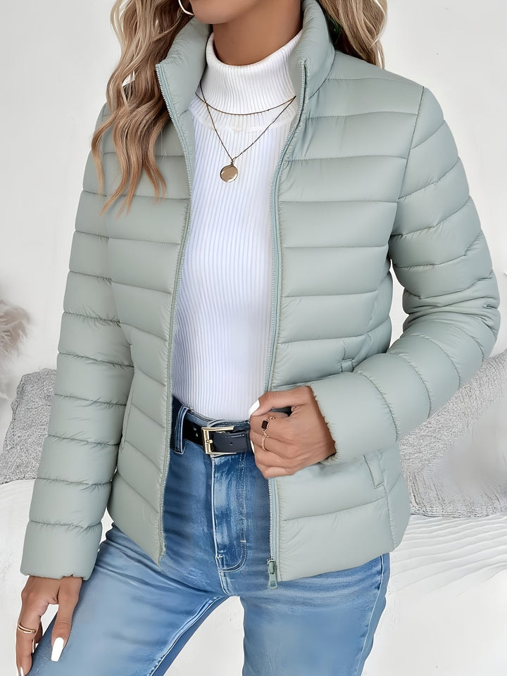 Women's lightweight quilted jacket with stand collar, ideal for fall fashion & mild winter. Everyday style.