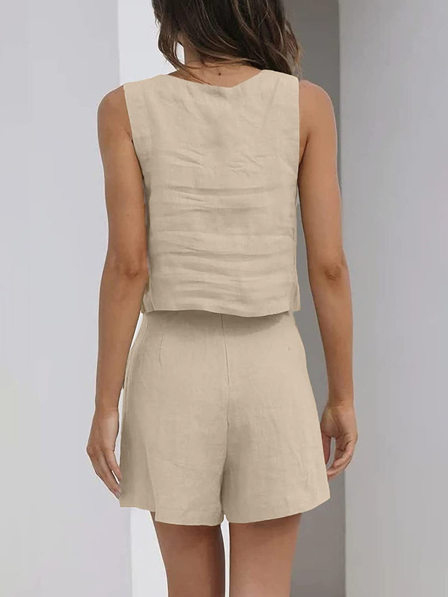 Stylish women's sleeveless crop top and shorts matching set in a solid color for warm weather.