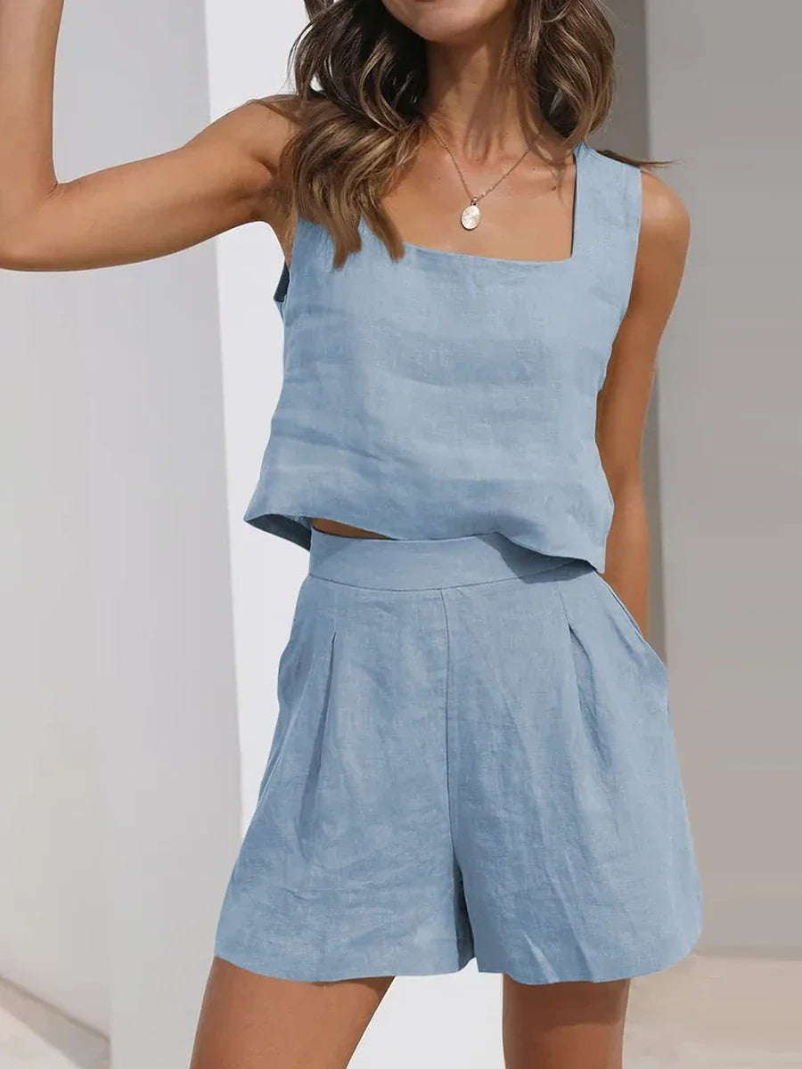 Chic women's sleeveless crop top and shorts matching set for a breezy and relaxed summer look.