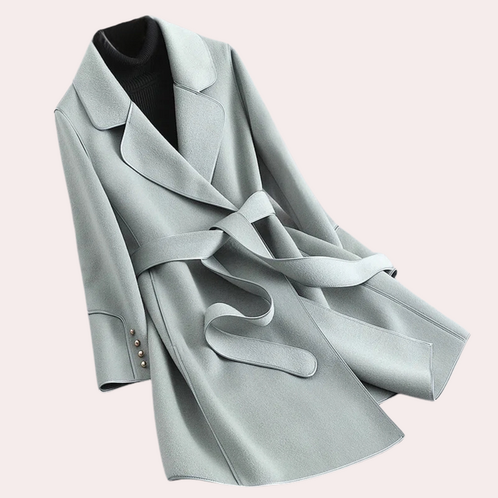 Modern women's lightweight trench coat, chic versatile fashion piece suitable for casual to evening events.