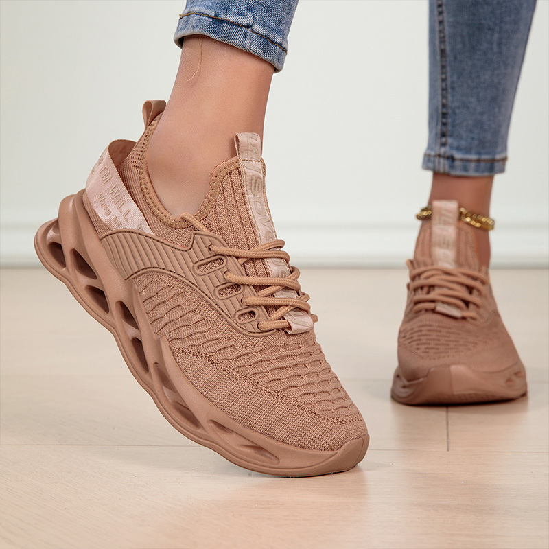 Lightweight women's sneakers, showcasing their flexible design for everyday walking and comfort.