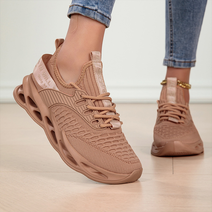Lightweight women's sneakers, showcasing their flexible design for everyday walking and comfort.