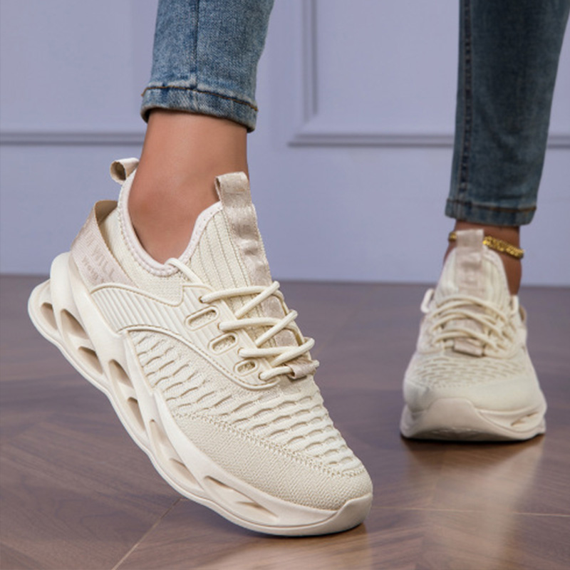 Stylish women's athletic shoes with a breathable upper, offering flexibility & comfort for walking.
