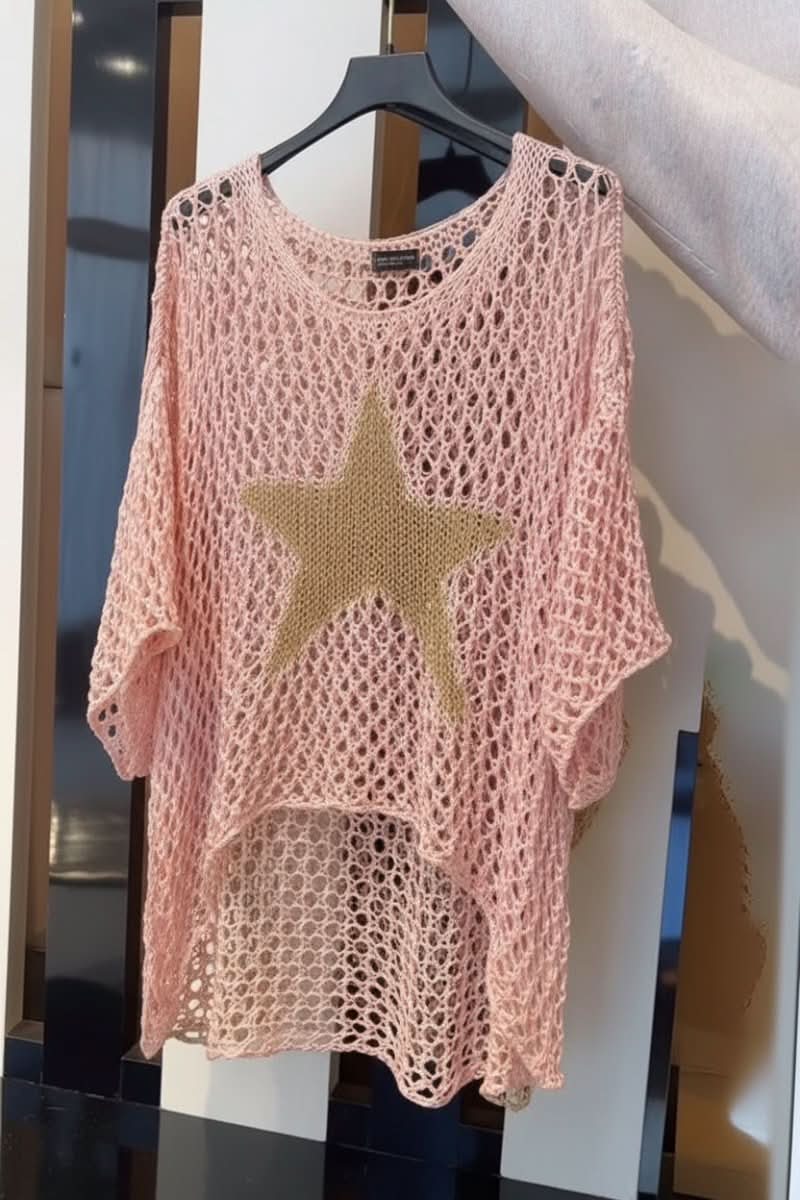 Pink women's crochet crop top. Lightweight summer festival wear, featuring a stylish open weave texture and design.