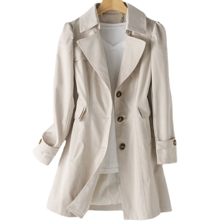 Casual women's hooded windbreaker, rain resistant, with adjustable waist. Ideal for spring/fall weather protection.