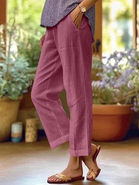 Ladies' relaxed fit tapered linen pants with elastic waist, designed for comfortable everyday casual style.