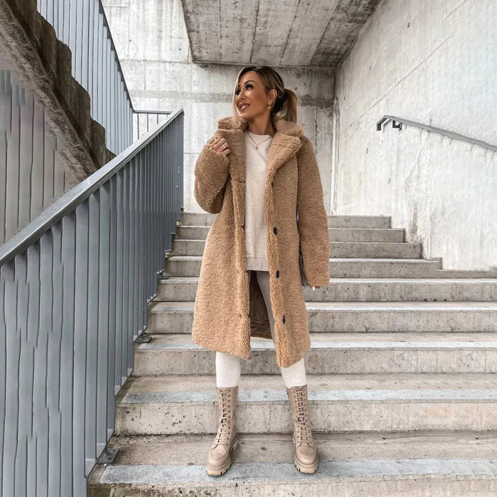 Soft, shaggy women's teddy coat, designed for maximum coziness and warmth during cold winter days.