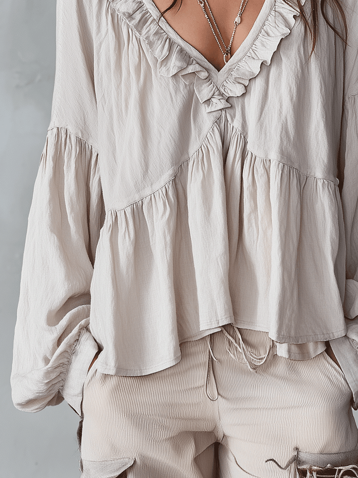 Beautiful women's long sleeve bohemian blouse. Loose fit ruffle top, elegant and versatile for spring.