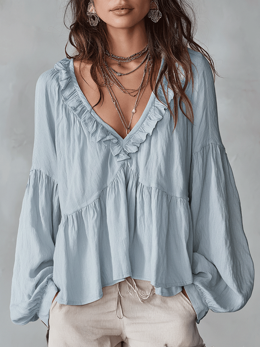 Vintage style women's long sleeve ruffle top. Bohemian loose fit blouse for elegant spring outfits.