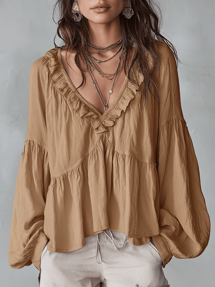 Versatile women's bohemian long sleeve blouse. Loose fit ruffle top, ideal for casual or elegant looks.