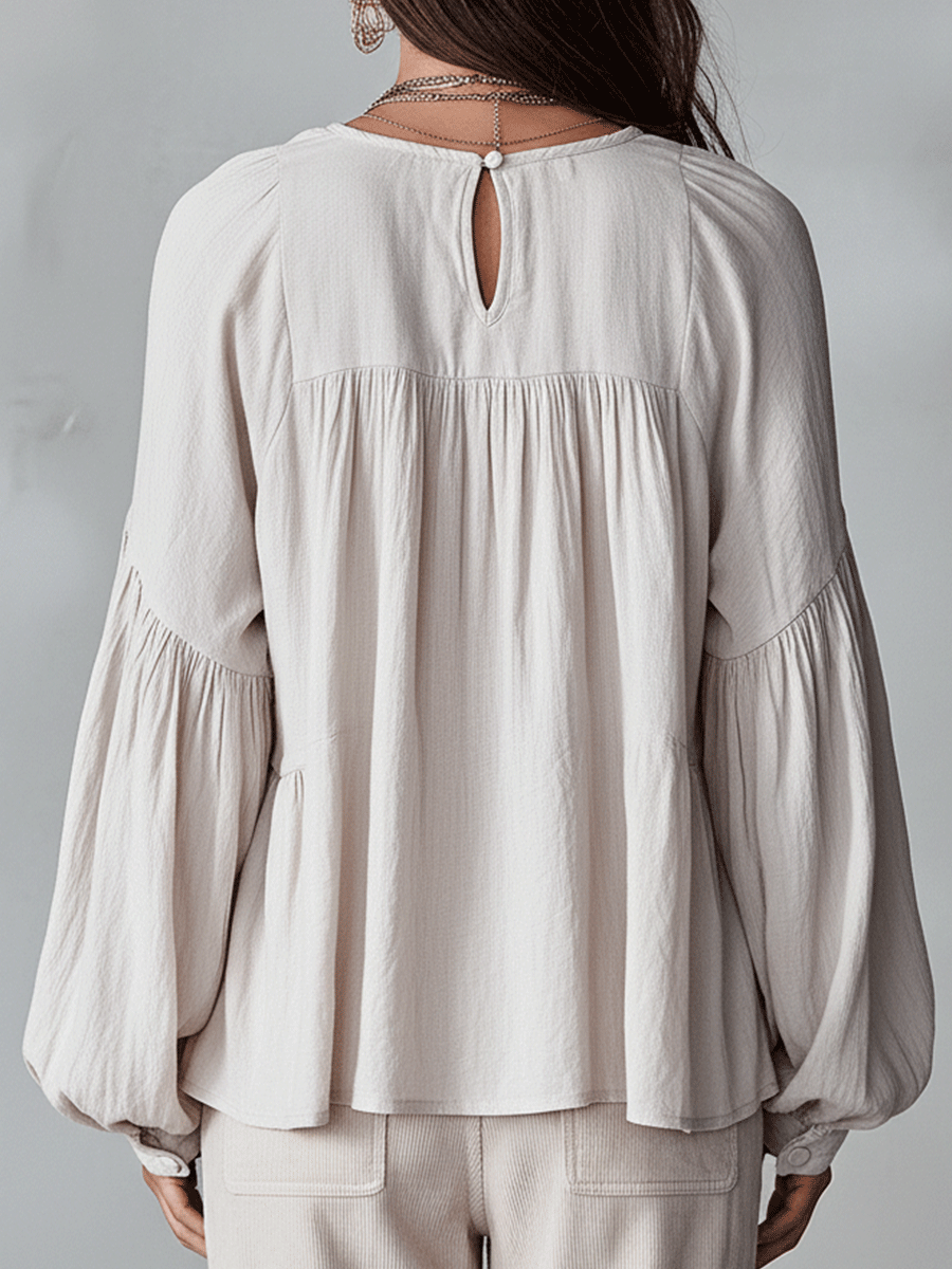 Chic women's long sleeve bohemian blouse. Loose fit, ruffle top with vintage style for spring fashion.