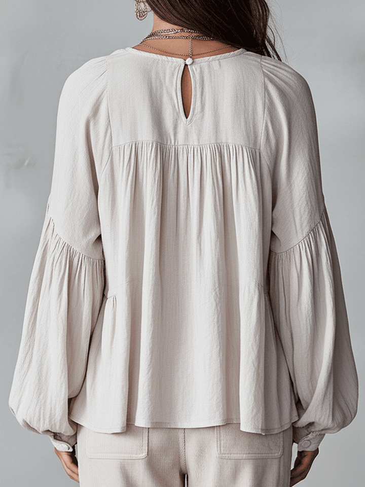 Chic women's long sleeve bohemian blouse. Loose fit, ruffle top with vintage style for spring fashion.