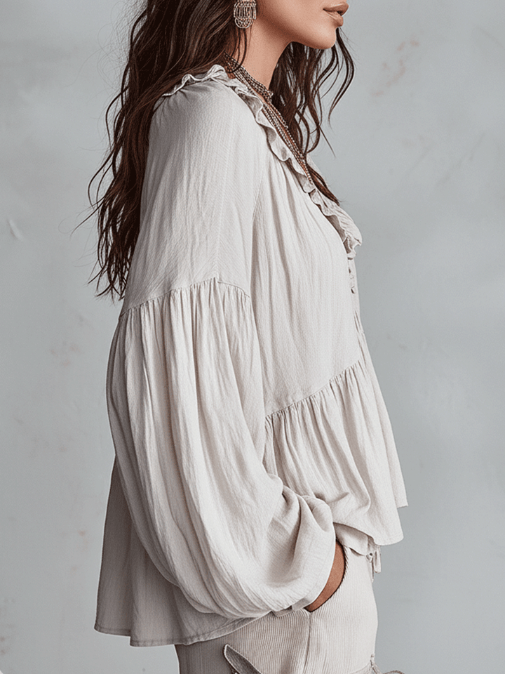 Stylish women's bohemian loose fit blouse. Long sleeve ruffle top, elegant and casual for spring.