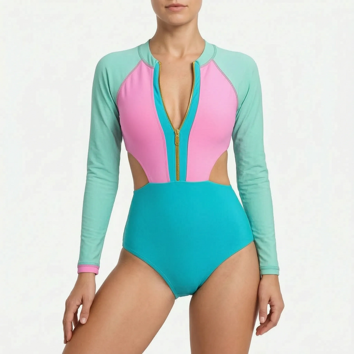 Women's active long-sleeve one-piece swimsuit, featuring stylish cutouts, front zip & trendy color block.
