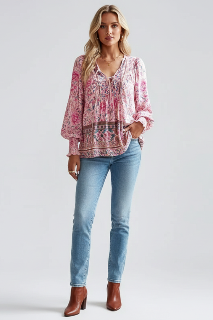 Stylish women's floral pattern blouse with long sleeves. Versatile V-neck top for casual spring fashion.