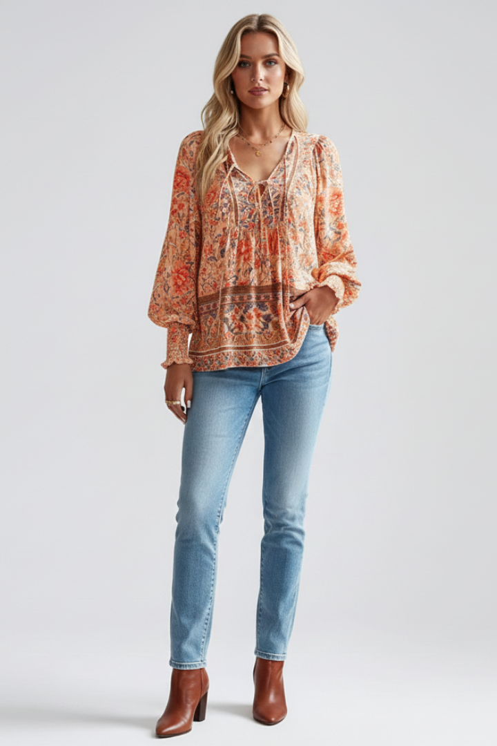 Women's long sleeve V-neck floral blouse with vibrant pattern. Loose fitting top for casual spring wear.