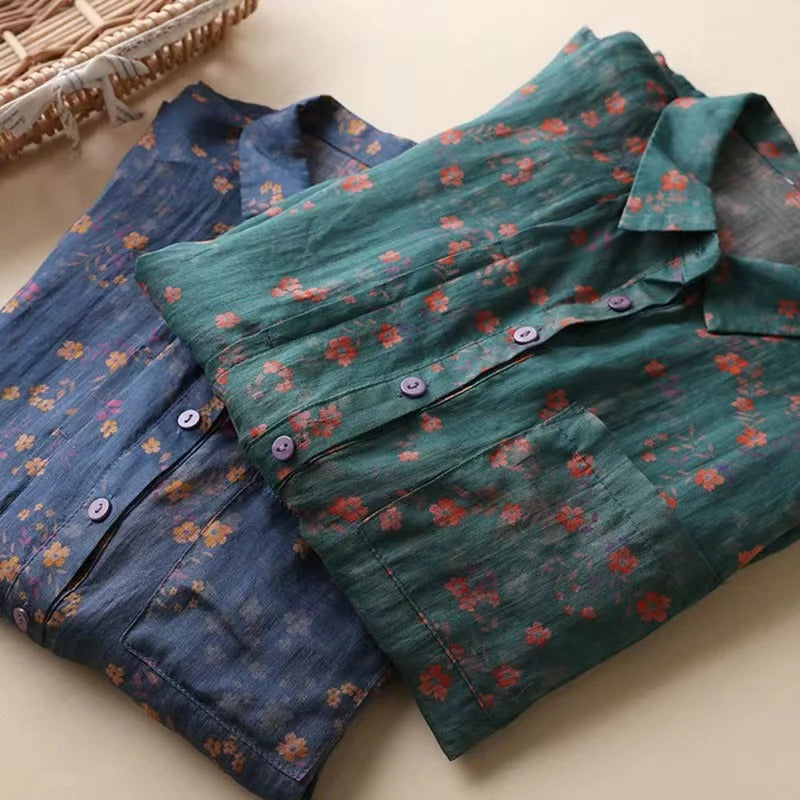 Blue floral women's half-placket top with buttons. Offers everyday comfort & stylish look for spring & summer.