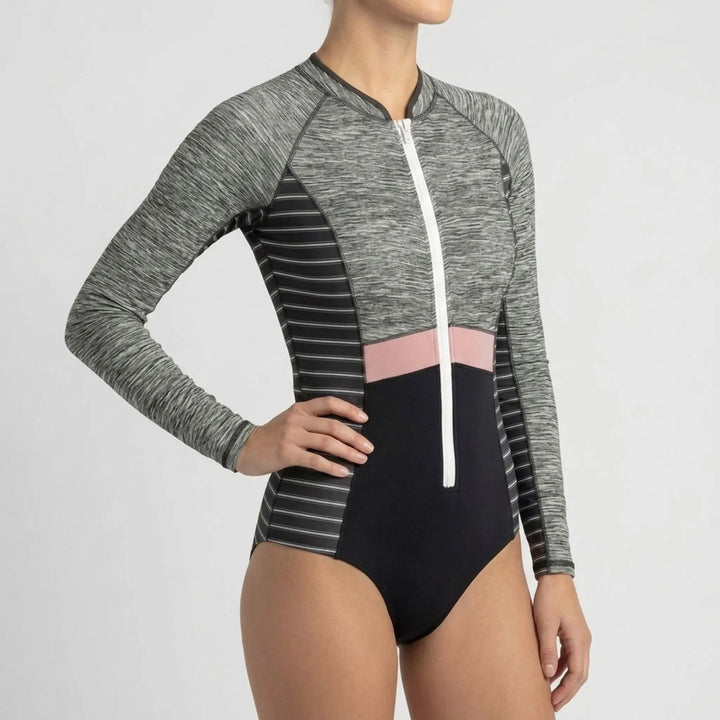 Women's athletic long-sleeve one-piece swimsuit, full-zip design for water sports & sun coverage.
