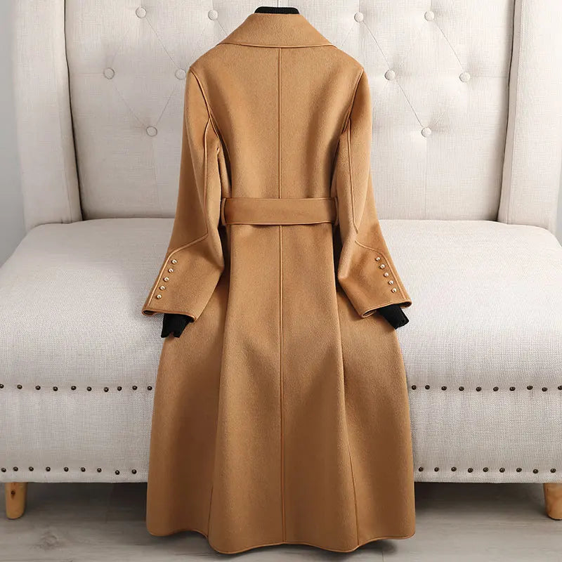 Taupe women's long trenchcoat, belted, tailored fit. Elegant fall & winter outerwear for versatile styling.