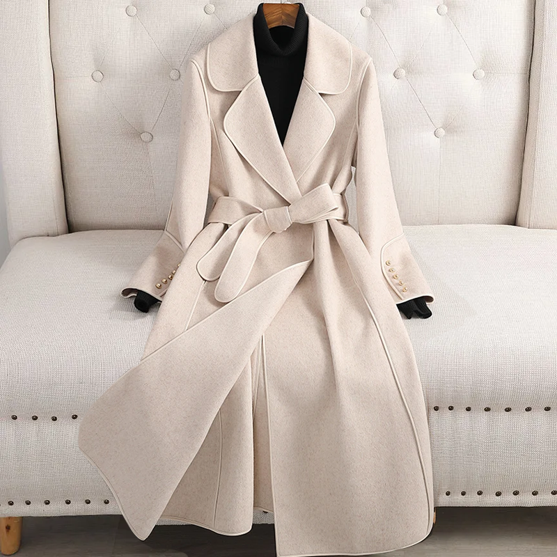 Crimson red women's long trenchcoat with belted waist. Tailored fit, elegant fall & winter fashion outerwear.