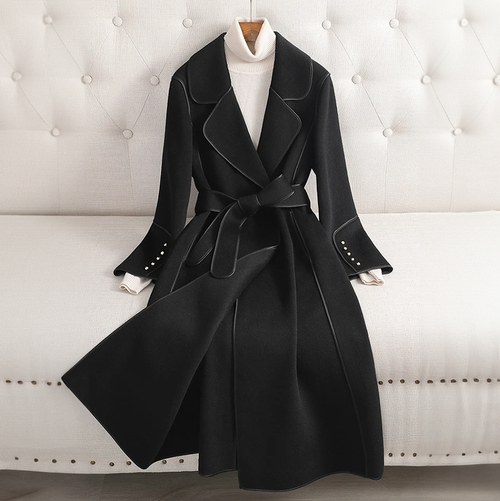 Elegant women's long trenchcoat, belted waist. Tailored fit, perfect versatile outerwear for formal to casual looks.