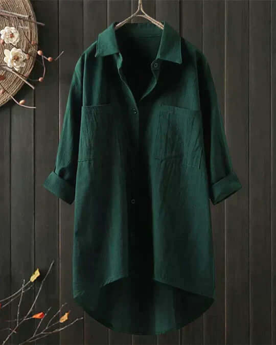 Stylish women's longline collared button-up blouse. Flowy, relaxed fit with double pockets for effortless casual wear.