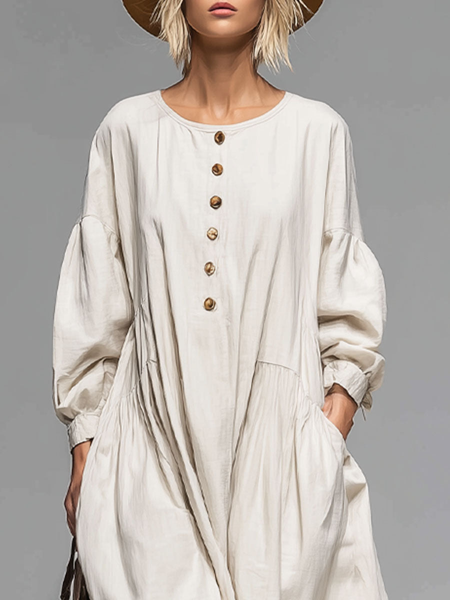 Comfortable women's midi dress, loose-fit, round neck, button-front, & pockets. Versatile for everyday spring & fall wear.