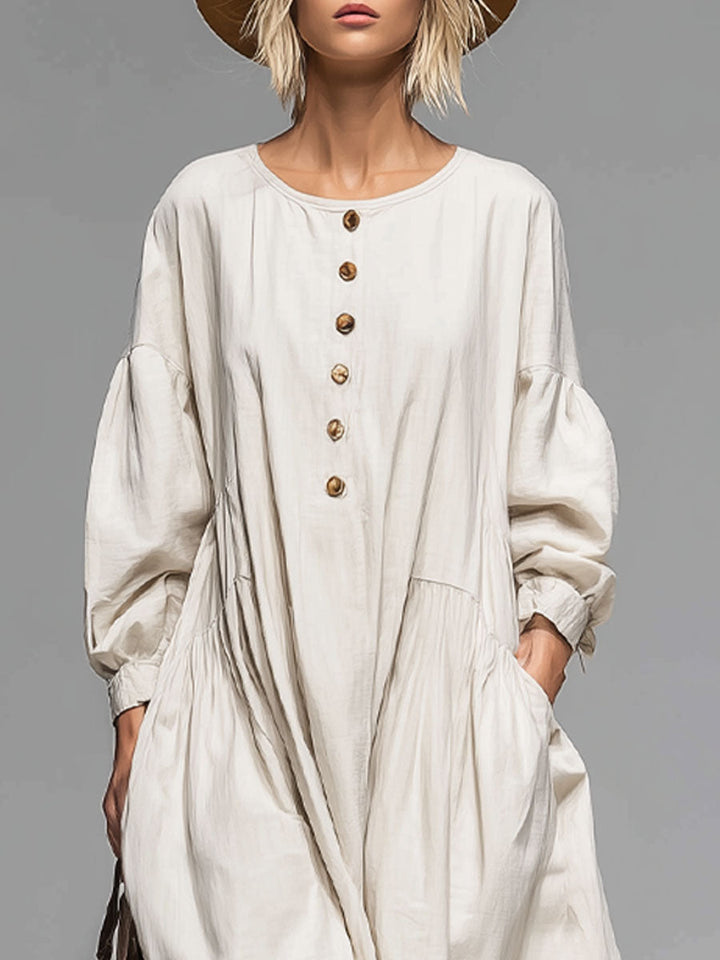 Comfortable women's midi dress, loose-fit, round neck, button-front, & pockets. Versatile for everyday spring & fall wear.