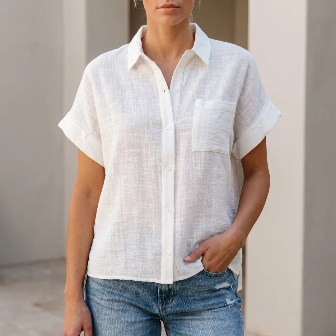 Women's loose fit short-sleeve button-down shirt, a comfortable casual top for summer fashion.