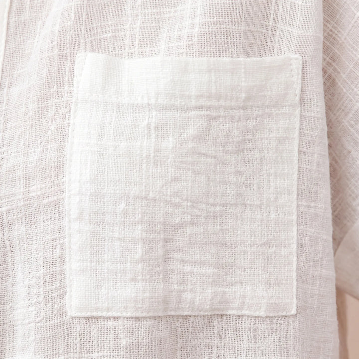 Stylish women's collared short-sleeve button-down shirt with a loose fit, ideal for summer fashion.
