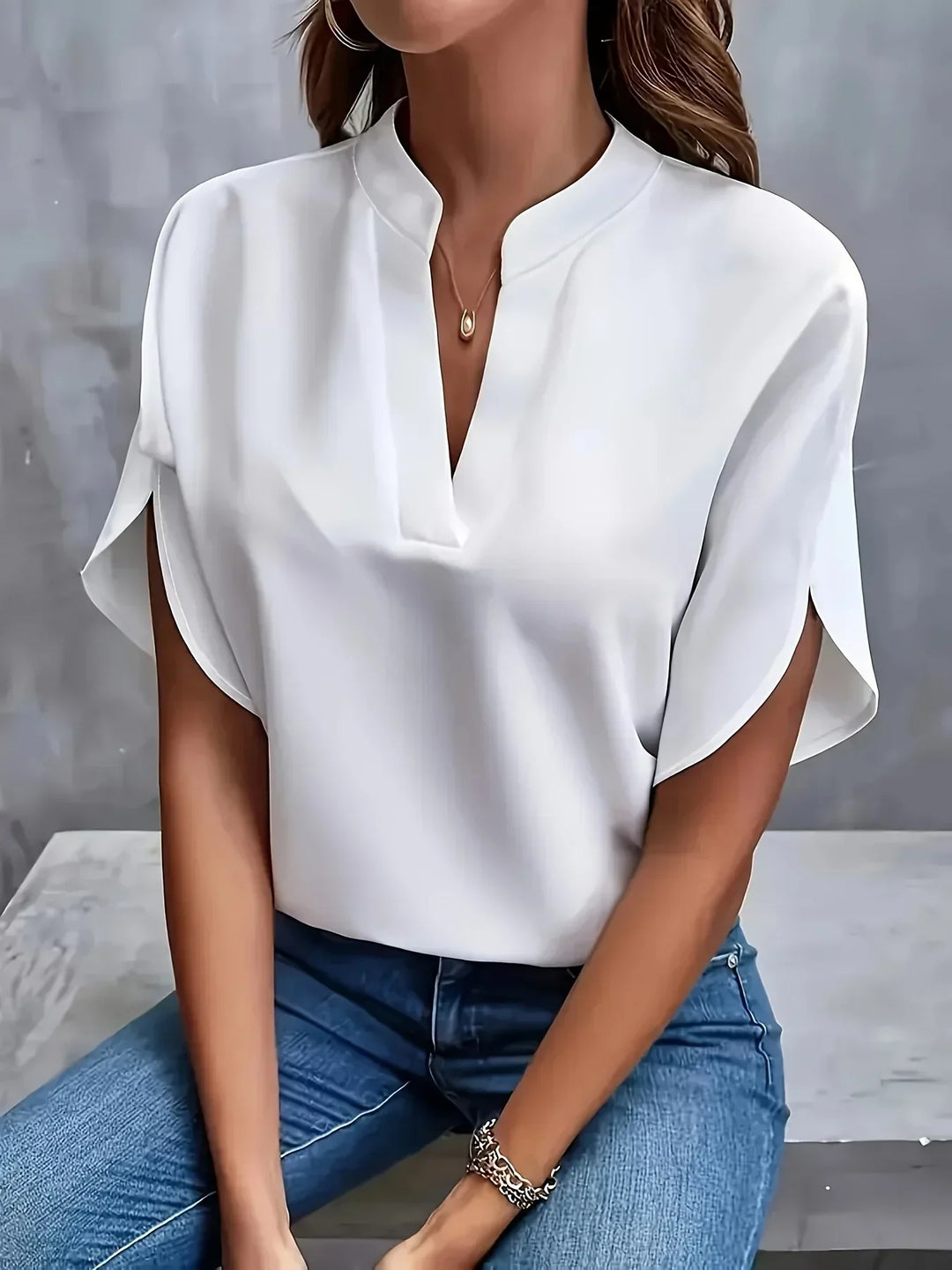 Elegant women's V-neck short sleeve blouse, a versatile loose fit top for various fashion occasions. Everyday comfort.