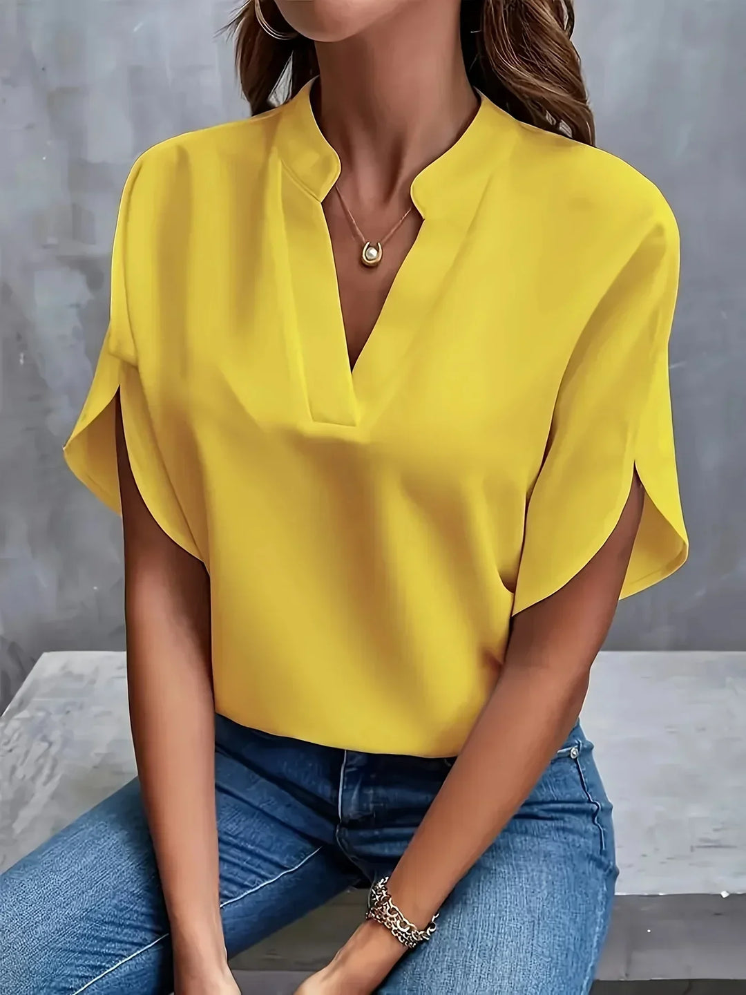 Casual women's short sleeve V-neck blouse, ideal for summer comfort & everyday wear. Stylish loose fit fashion top.