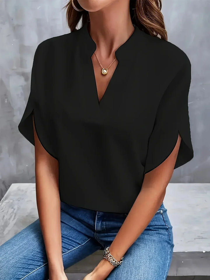 Office-friendly women's loose fit short sleeve V-neck blouse. A comfortable, elegant and versatile workwear top.